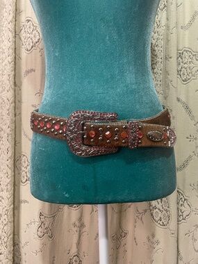 WB Atlas: Western-style belt featuring brown hair-on leather and pink crystals